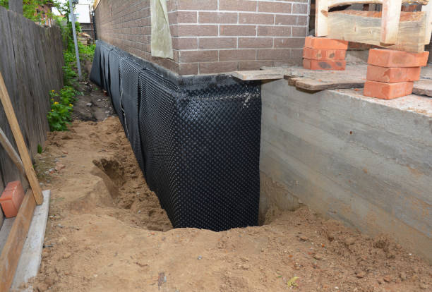 Happy homeowners after waterproofing job in Millington